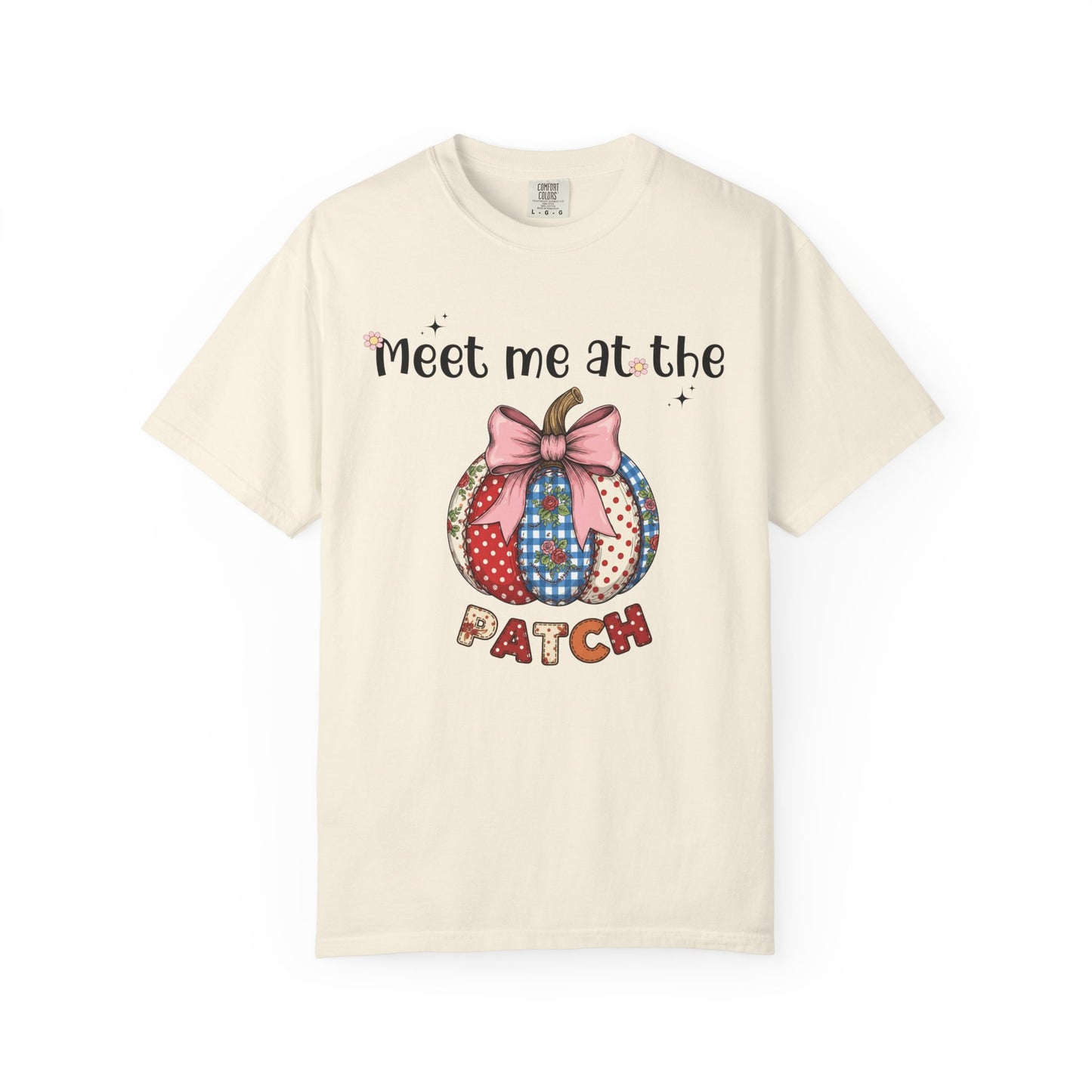 Beige t-shirt with a patchwork pumpkin design and text on a white background