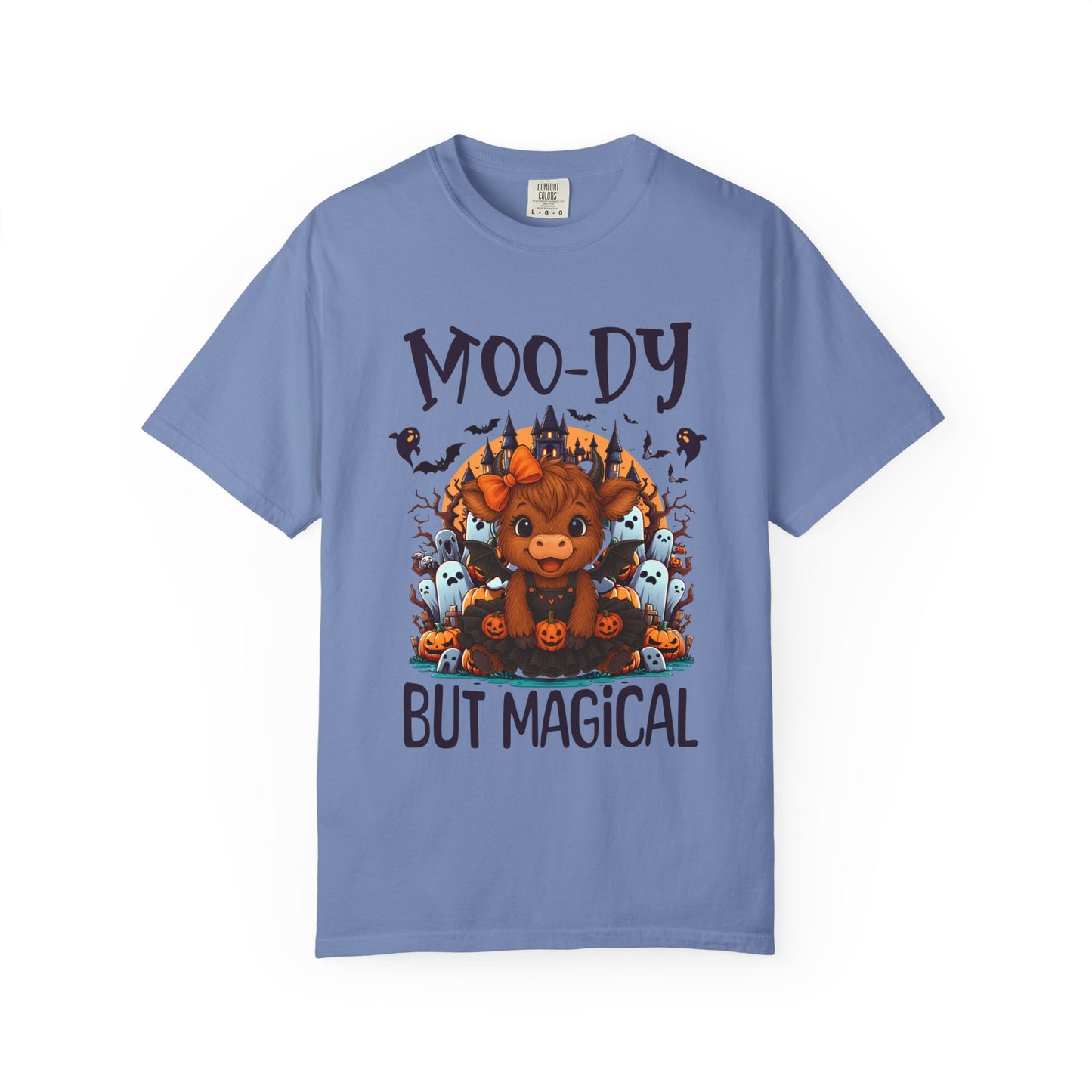 Blue t-shirt with a graphic of a moose surrounded by ghosts and text 'Moo-dy But Magical' on a white background.