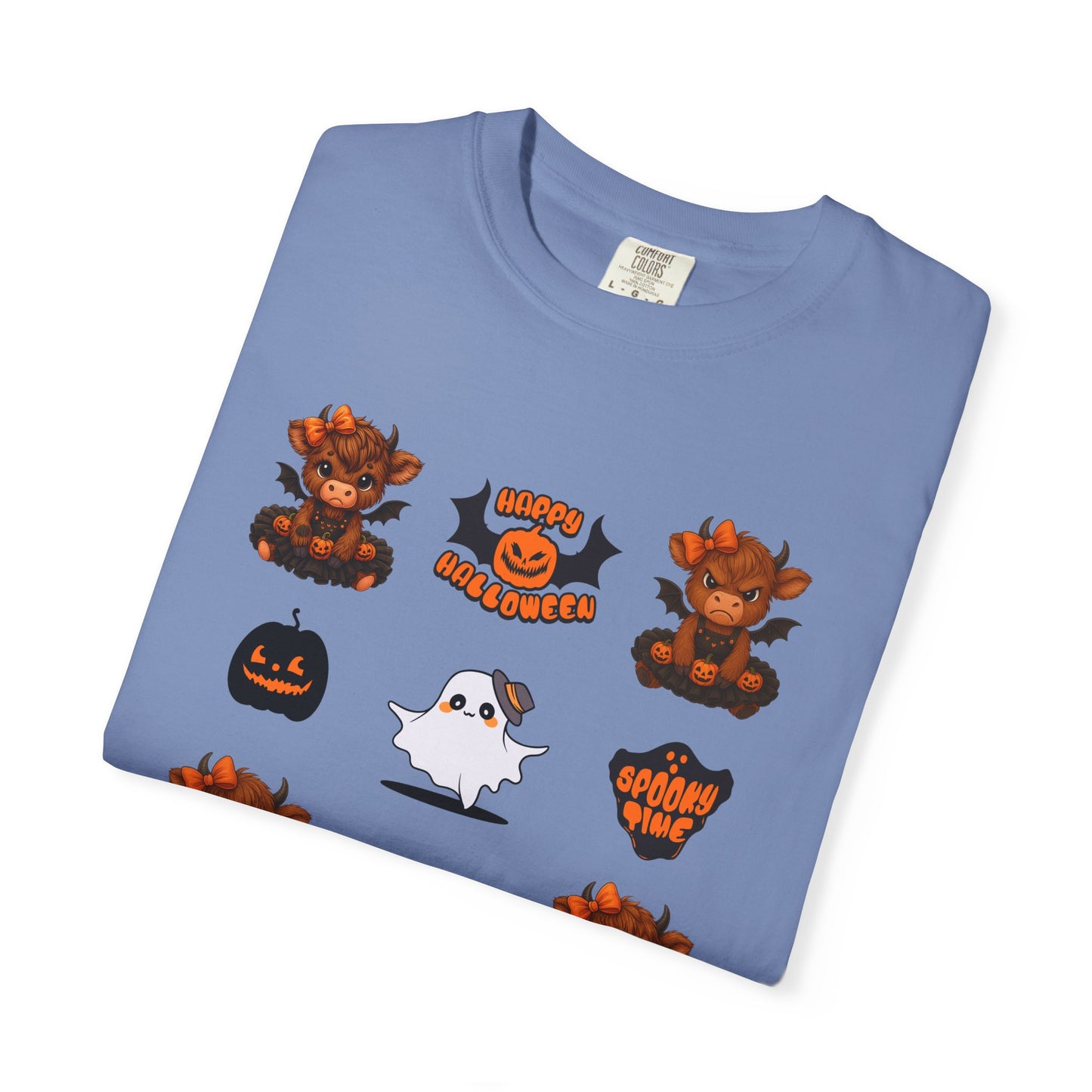 Folded blue t-shirt with Halloween-themed graphics on a white background