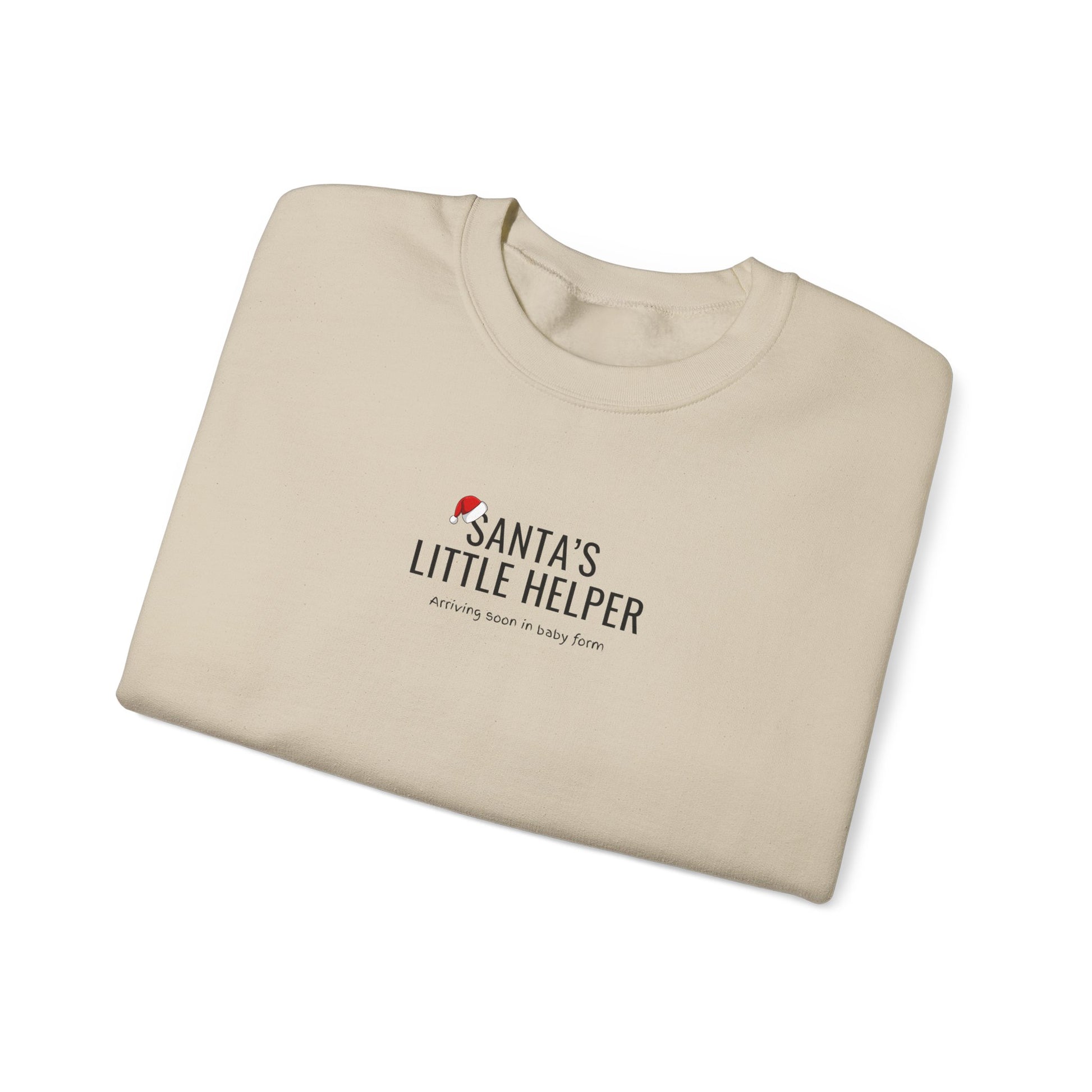 Folded beige sweatshirt with 'Santa's Little Helper' text on a white background