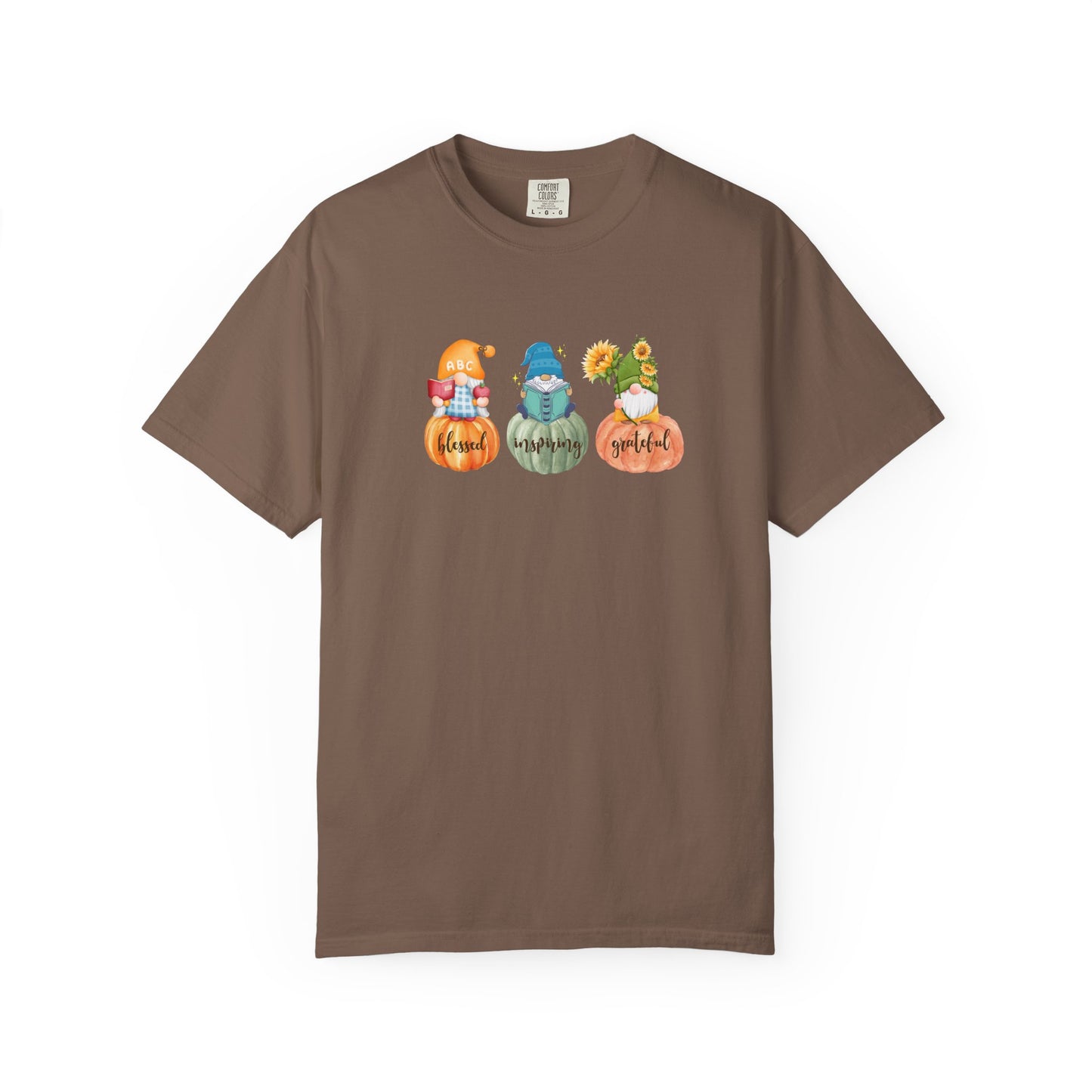 Brown t-shirt with gnomes and pumpkins design on a white background