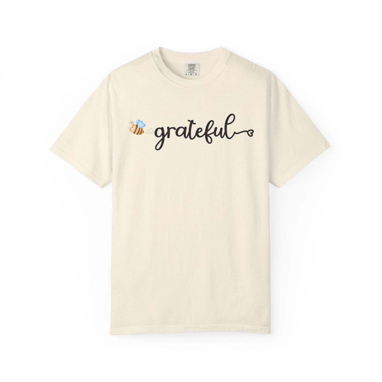 Beige t-shirt with 'grateful' text and bee design on a white background