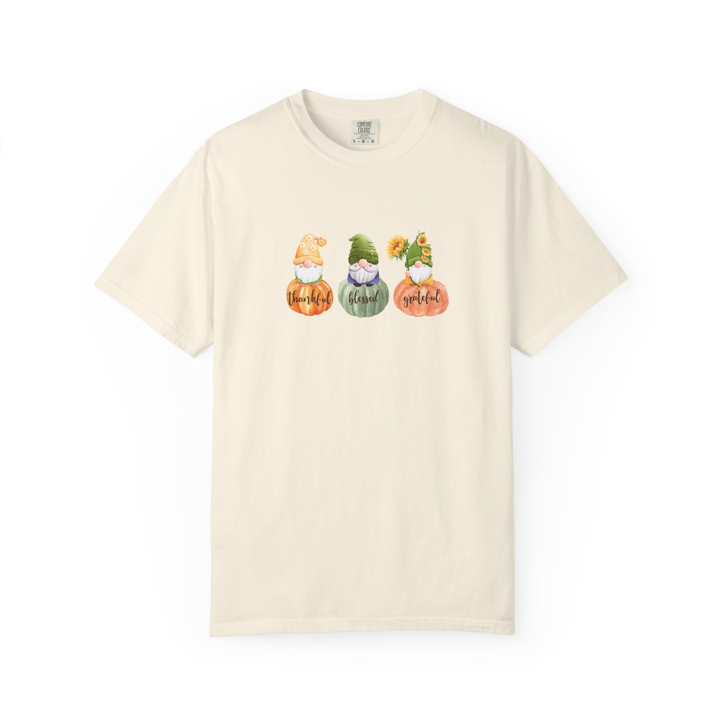 Beige t-shirt with a graphic of three cacti in pots and 'Thankful' text on a white background