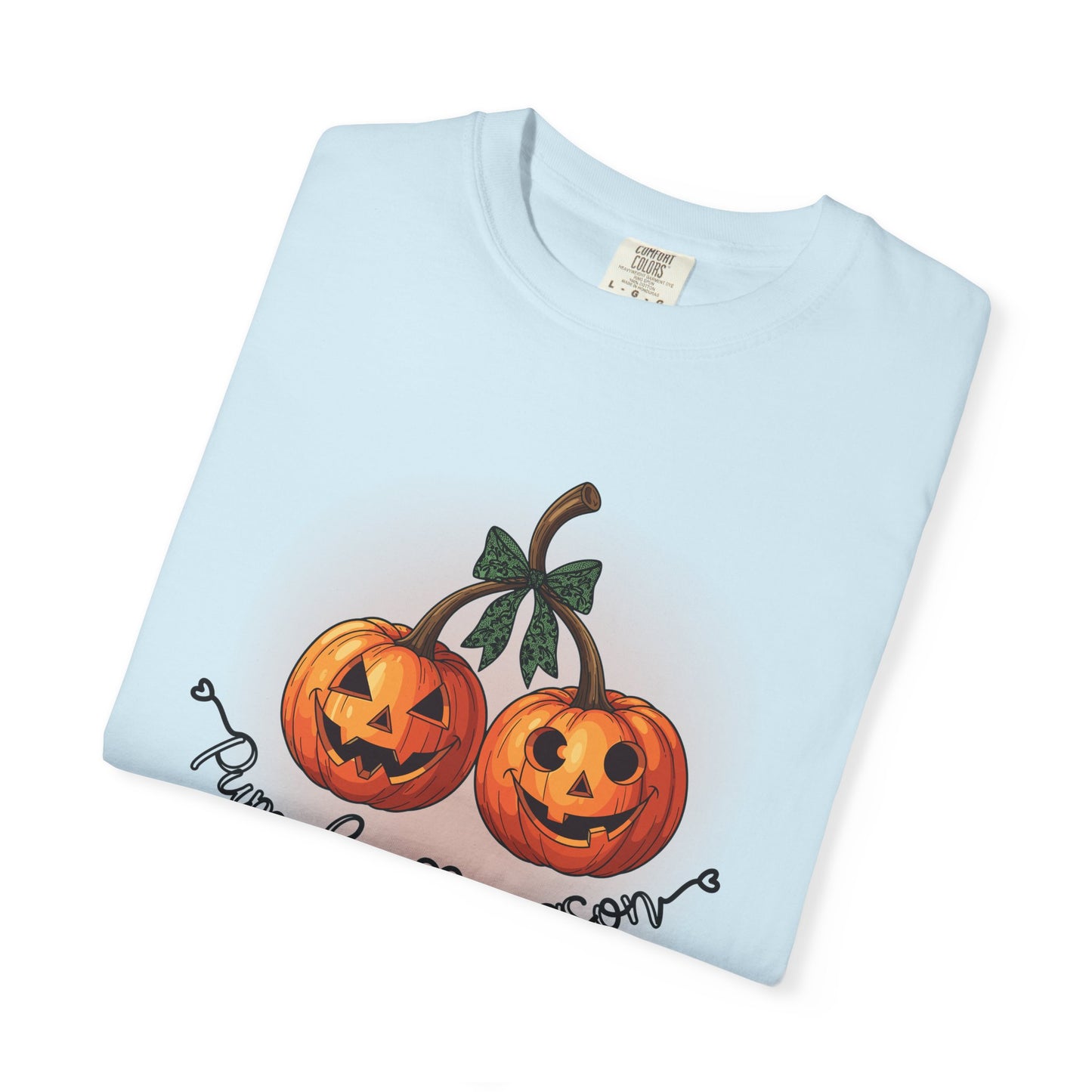 Light blue t-shirt with Halloween-themed pumpkins and text on a white background