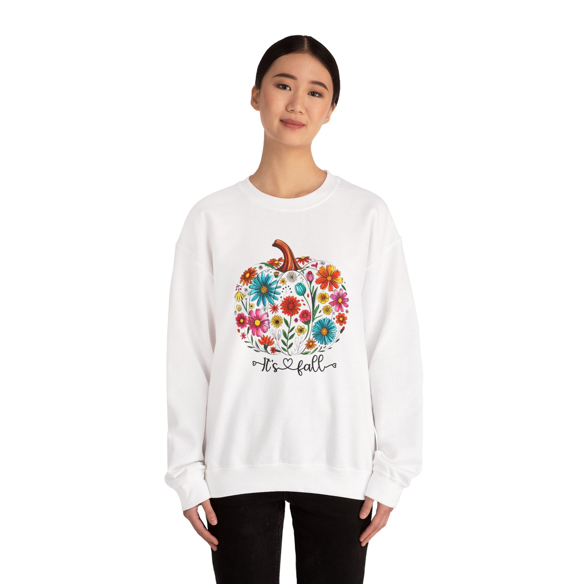 White sweatshirt with floral pumpkin design and 'It's Fall' text on a white background
