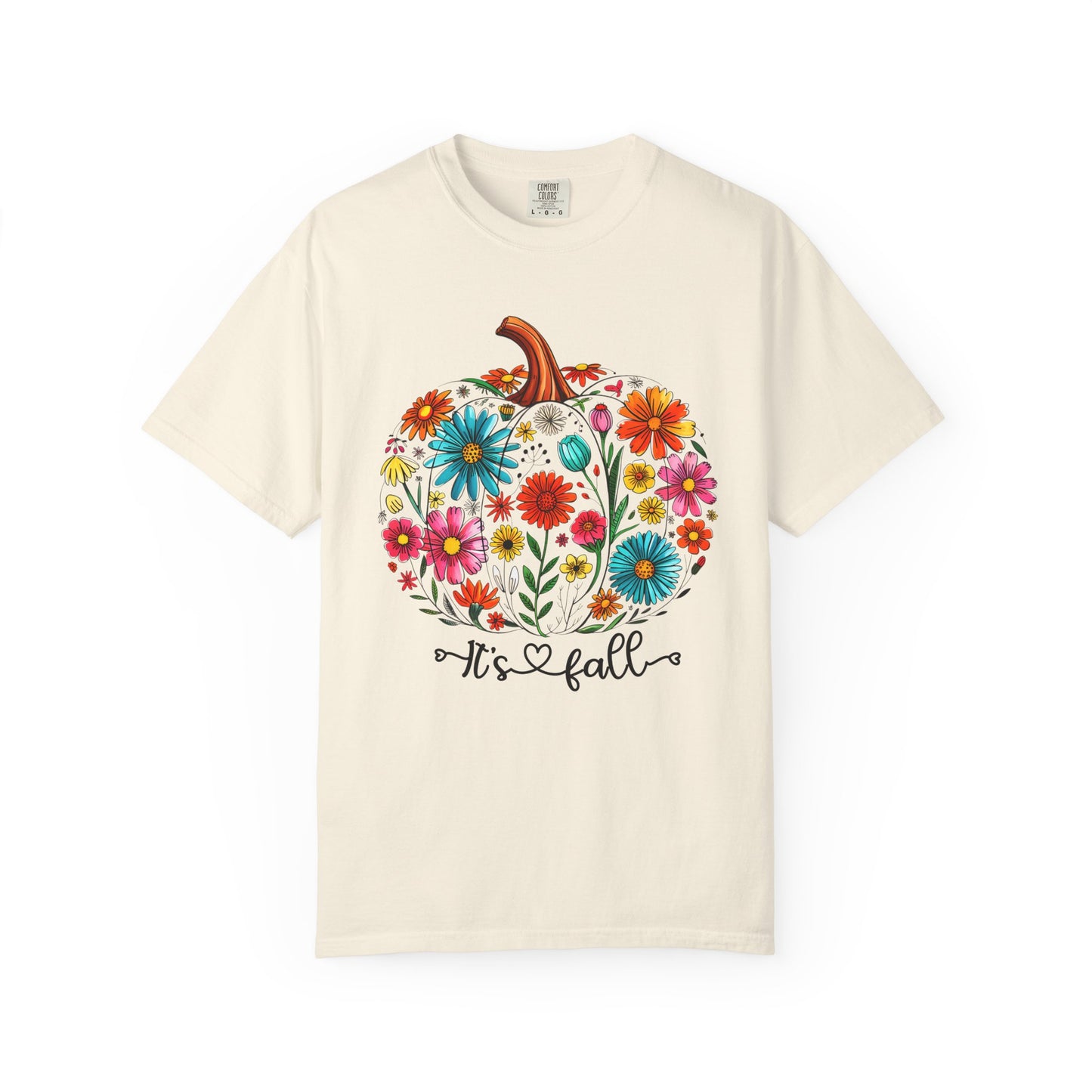 Beige t-shirt with a colorful pumpkin design and 'It's Fall' text on a white background