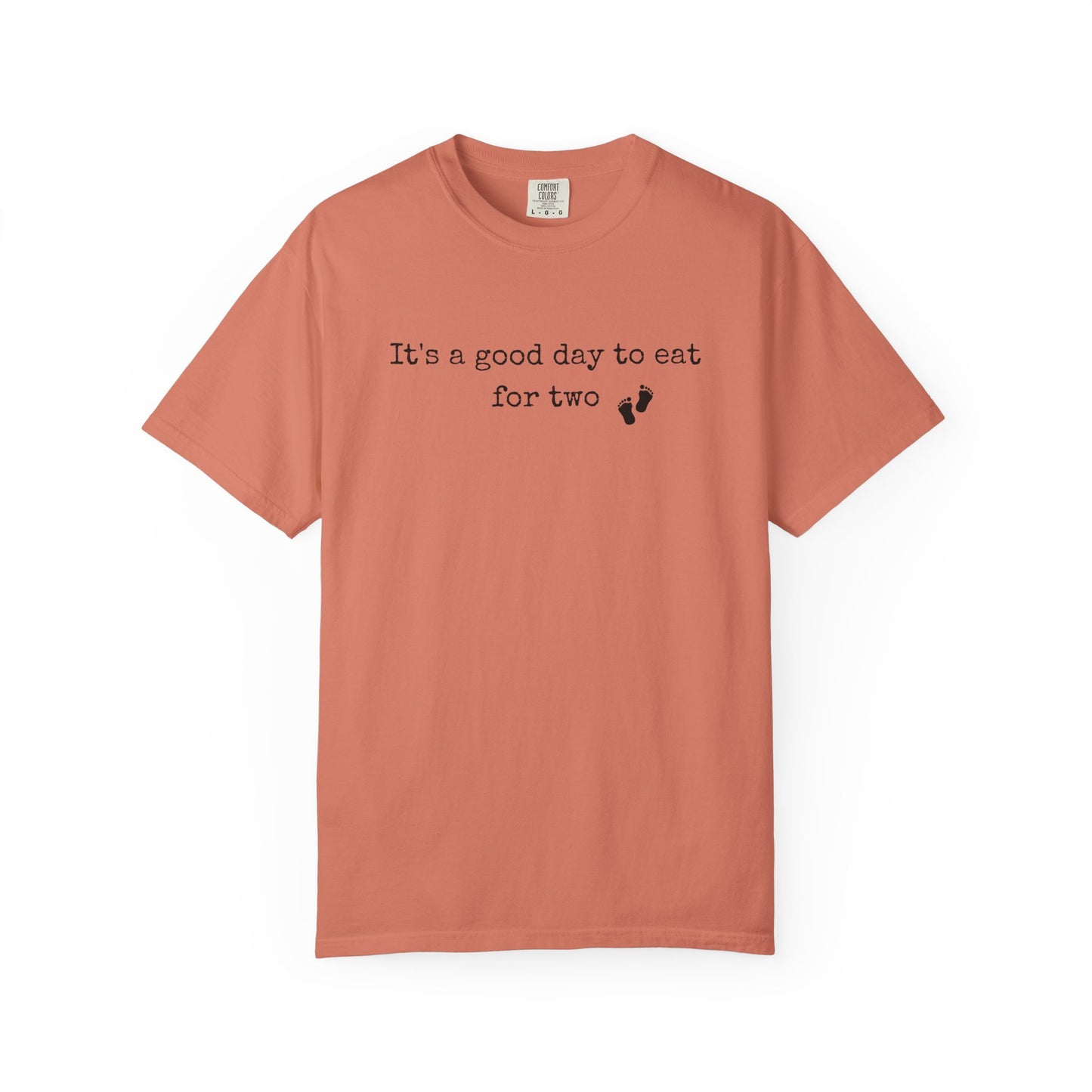 Coral t-shirt with text 'It's a good day to eat for two' on a white background