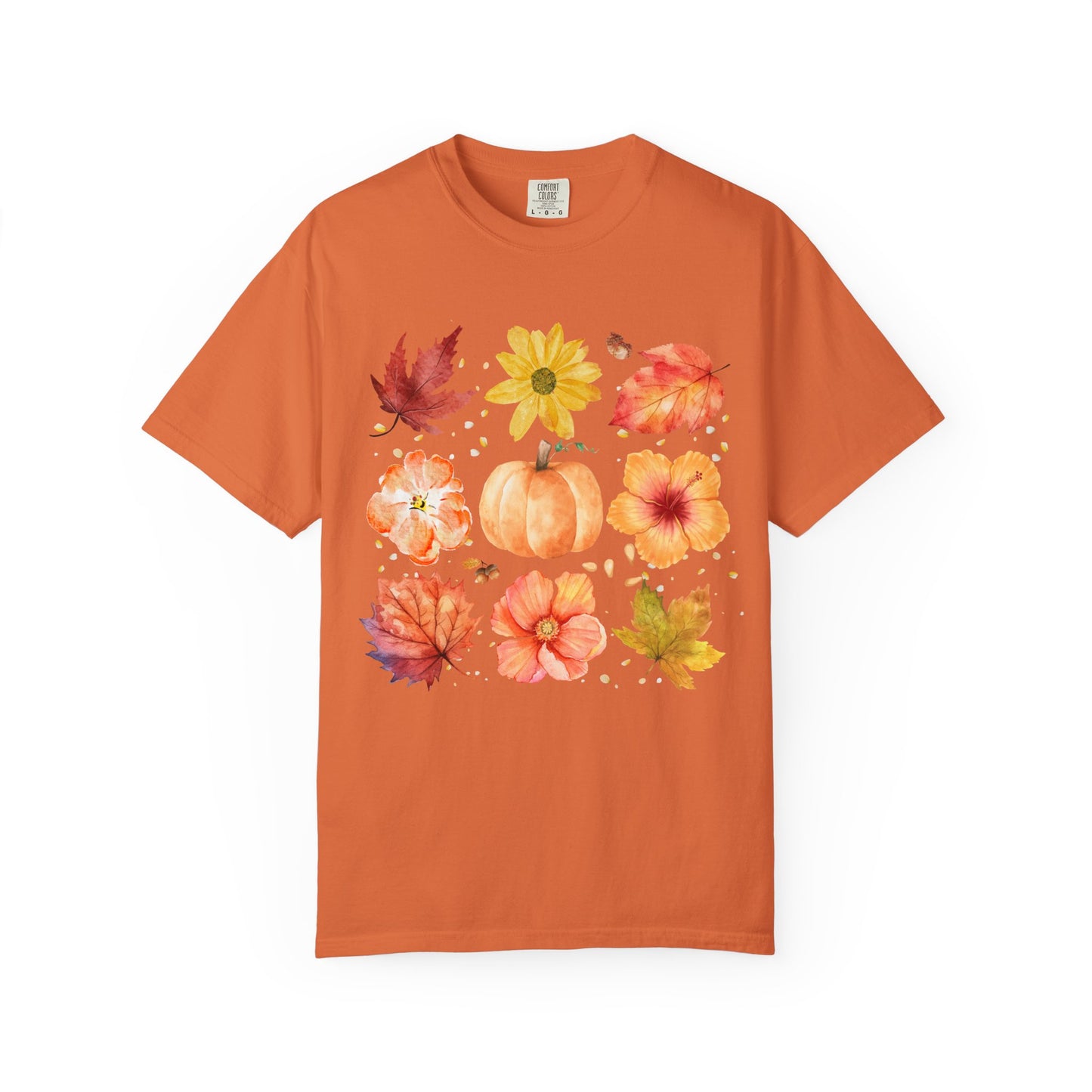 Orange t-shirt with autumn-themed design featuring pumpkins, leaves, and flowers on a white background.
