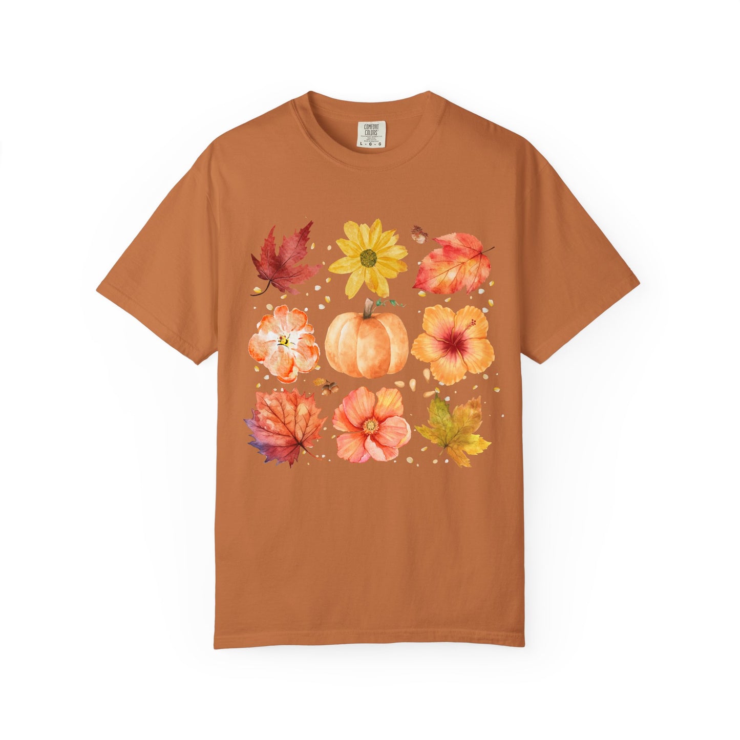 Brown t-shirt with autumn-themed design featuring leaves and pumpkins on a white background