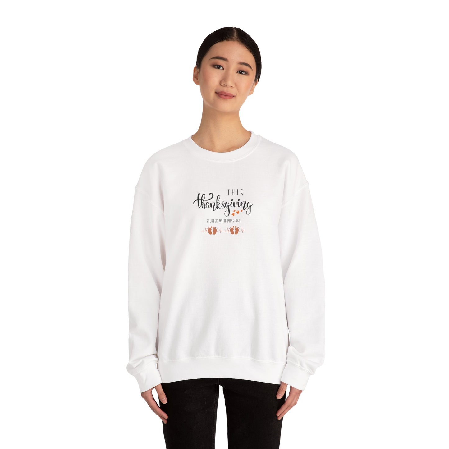 Person wearing a white sweatshirt with text and graphics on a white background