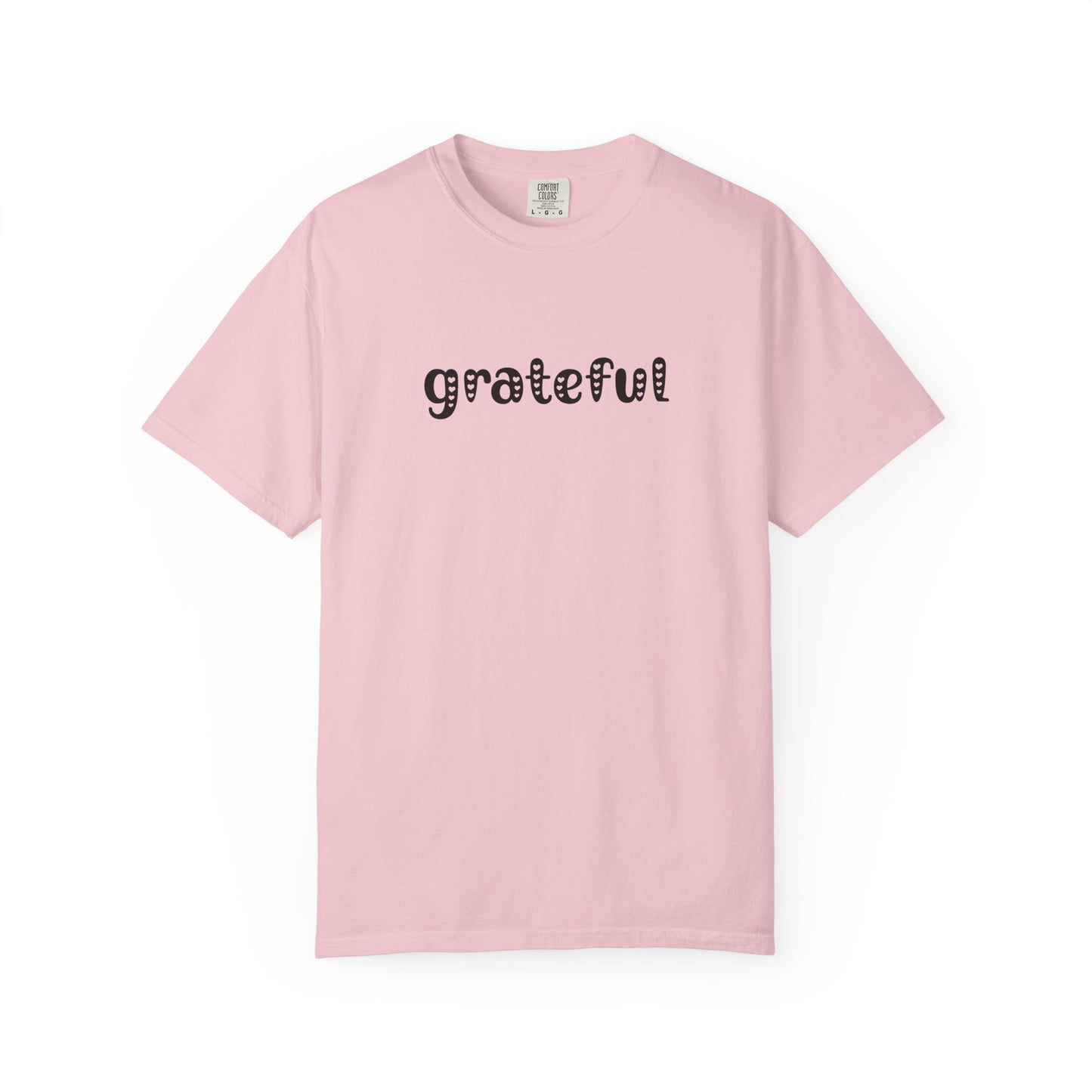 Pink t-shirt with 'grateful' text on a white background