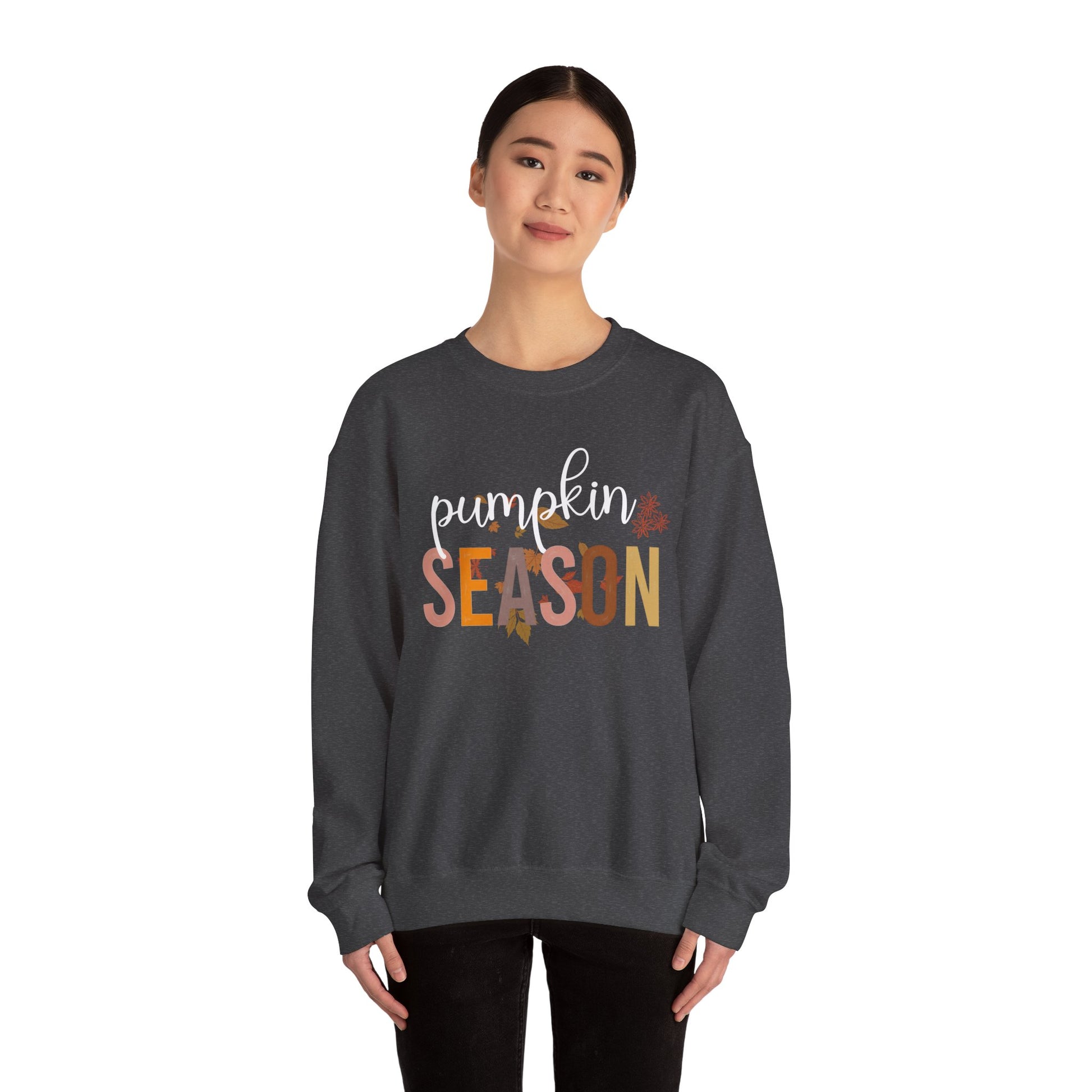Person wearing a dark gray sweatshirt with 'Pumpkin Season' text on a white background