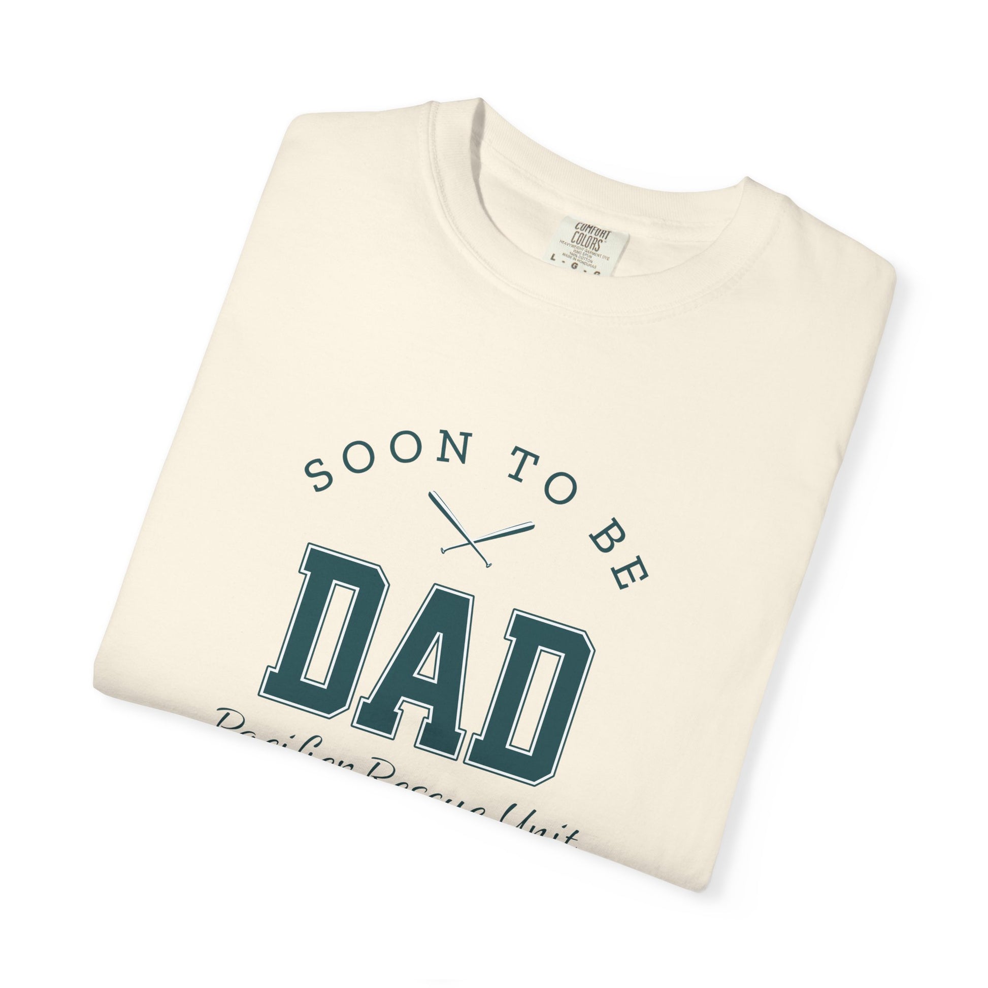 Folded t-shirt with 'Soon to be Dad' text on a white background