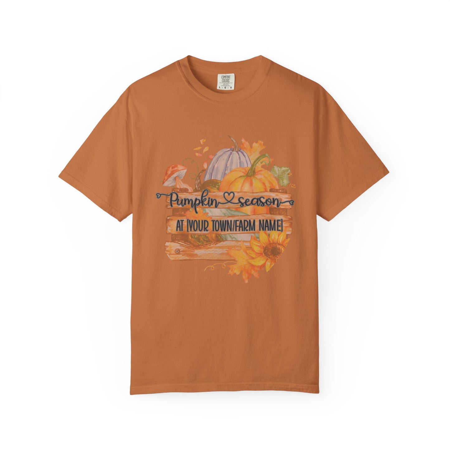 Orange t-shirt with pumpkin and sunflower design on a white background