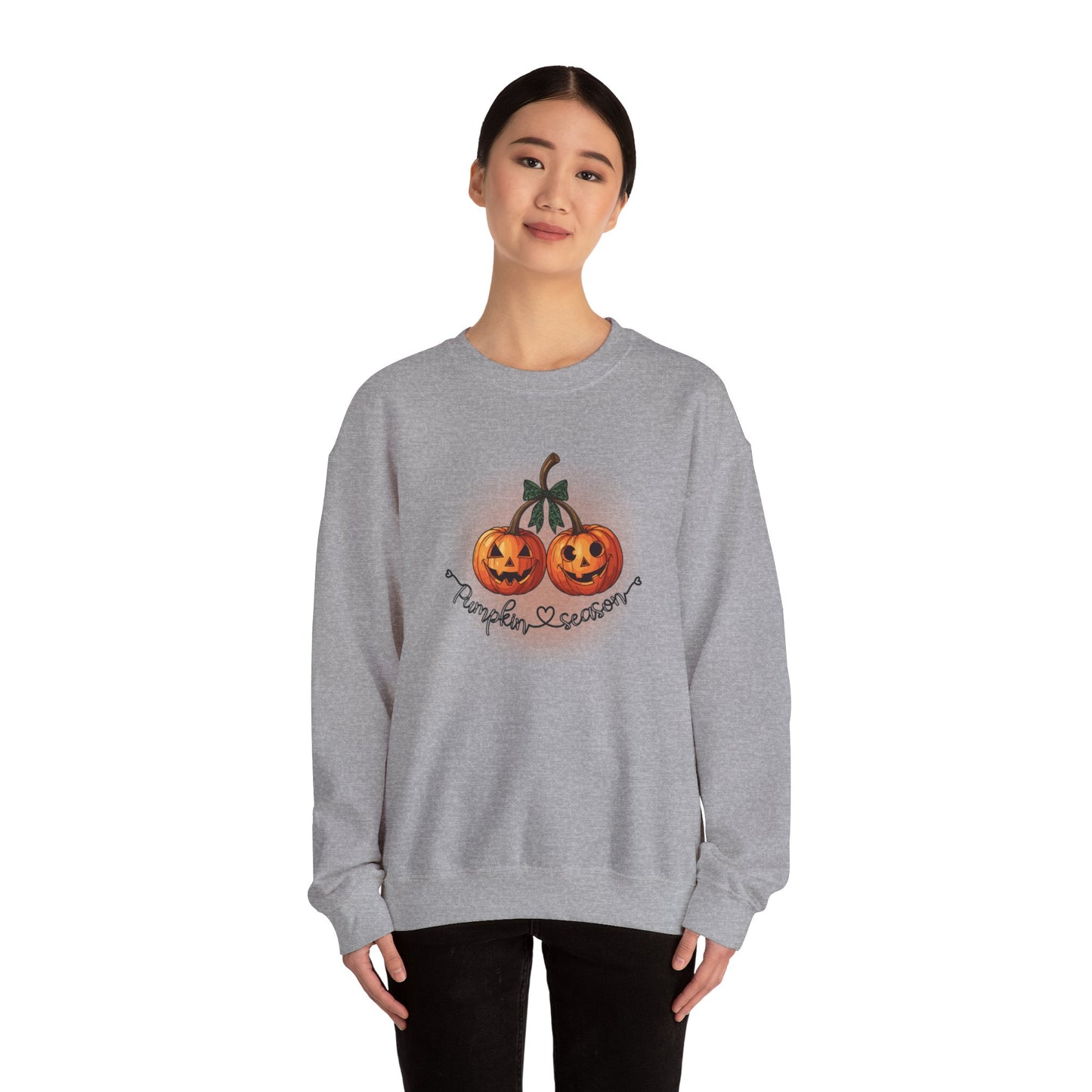 Person wearing a gray sweatshirt with Halloween-themed design on a white background