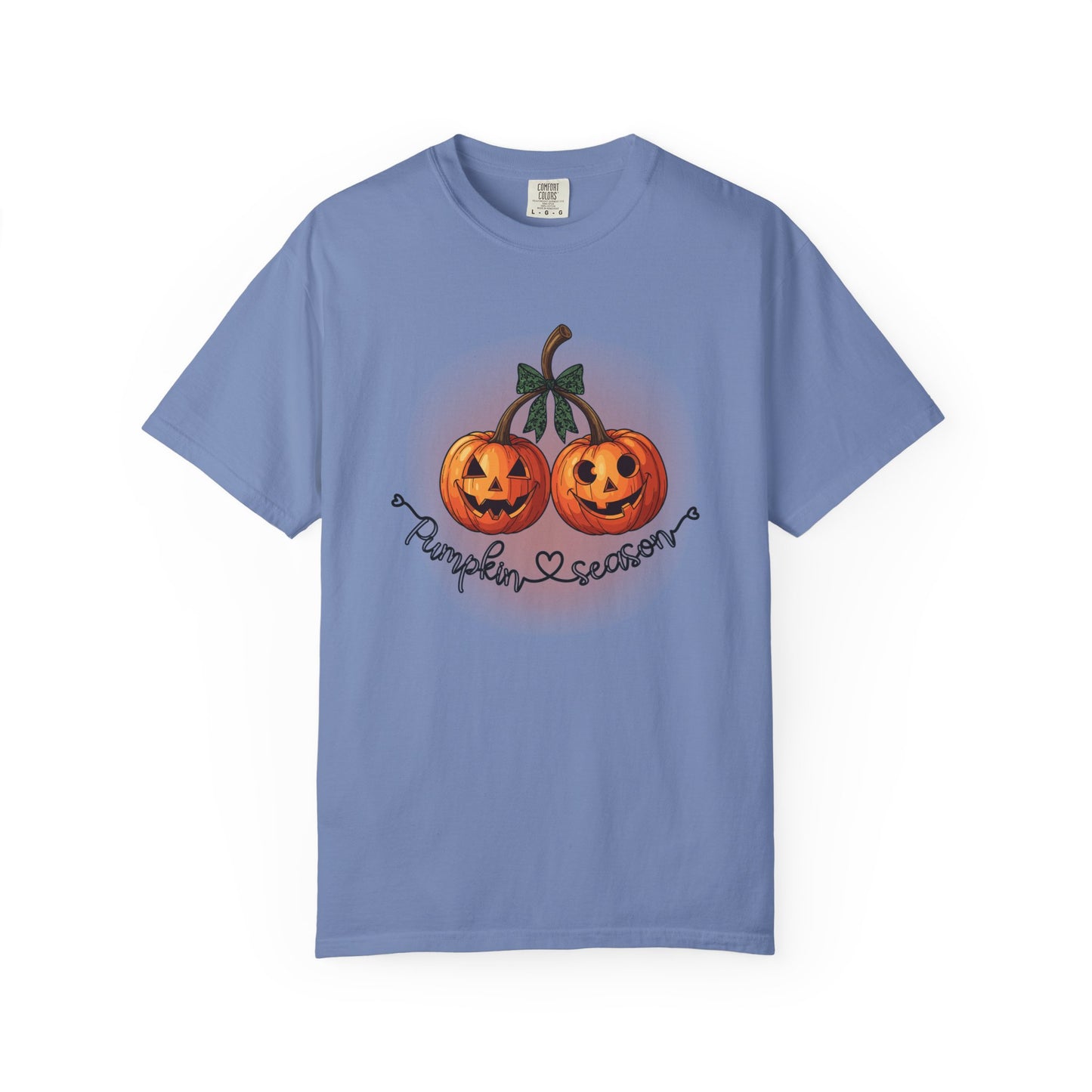 Blue t-shirt with pumpkin design and text on a white background