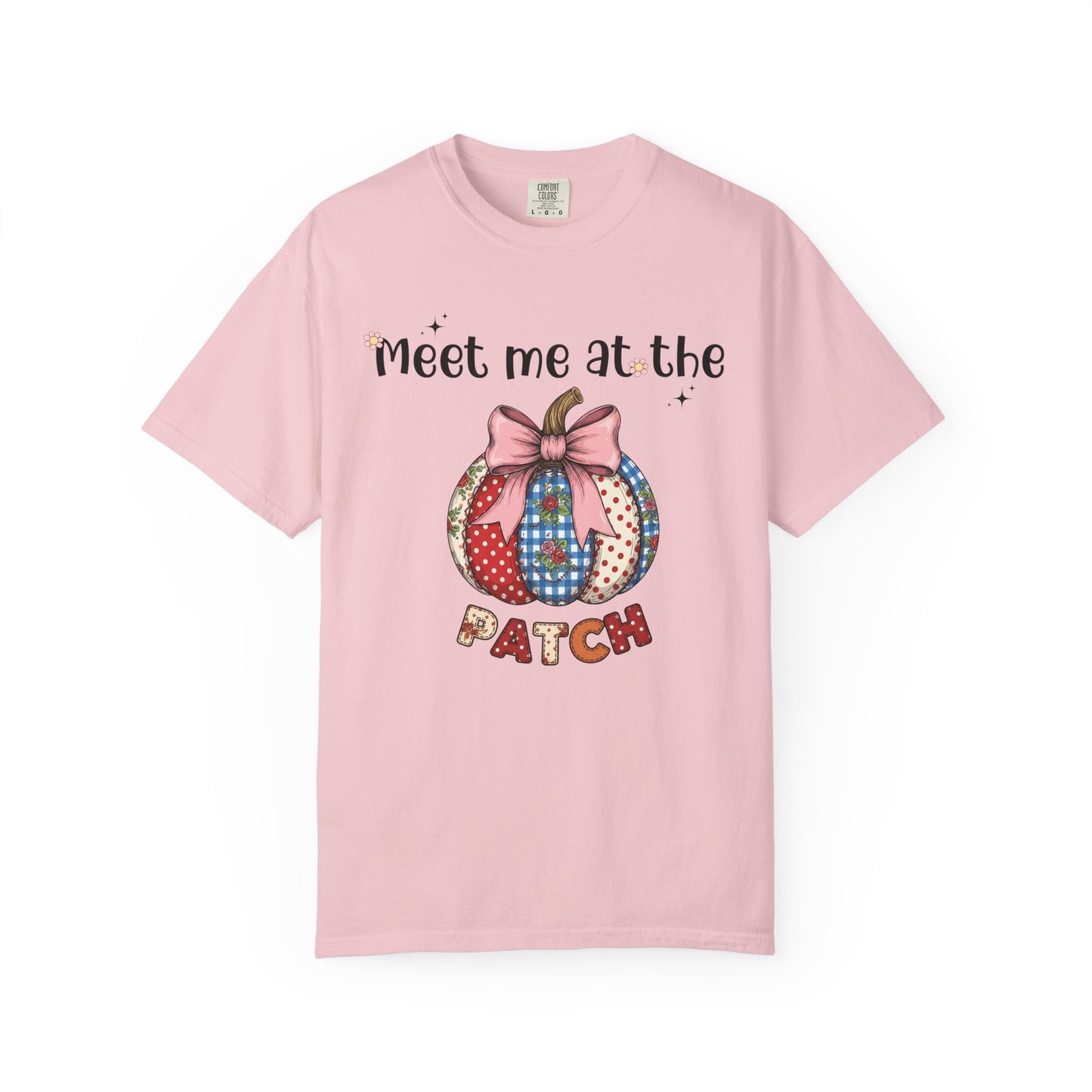 Pink t-shirt with a colorful pumpkin design and text on a white background