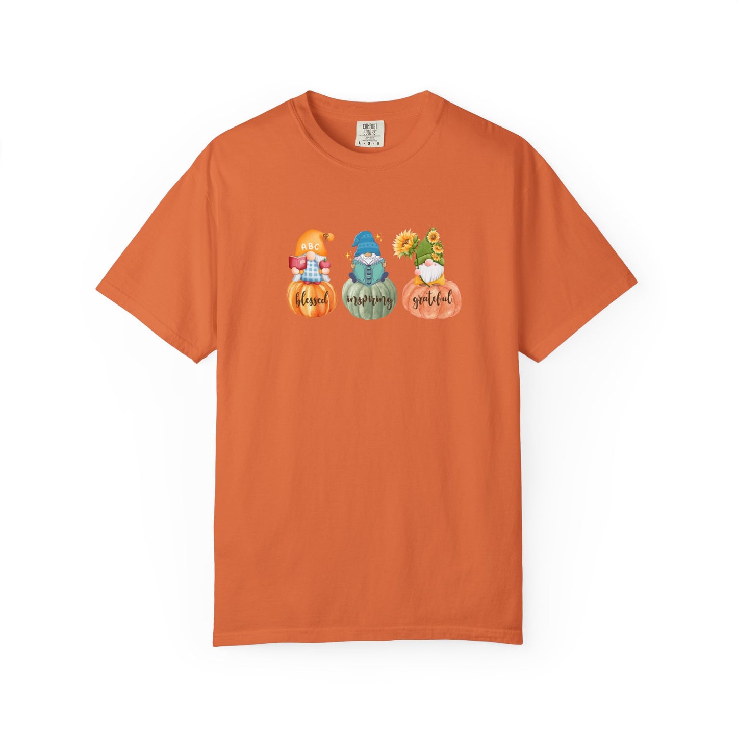 Orange t-shirt with gnomes and pumpkins design on a white background