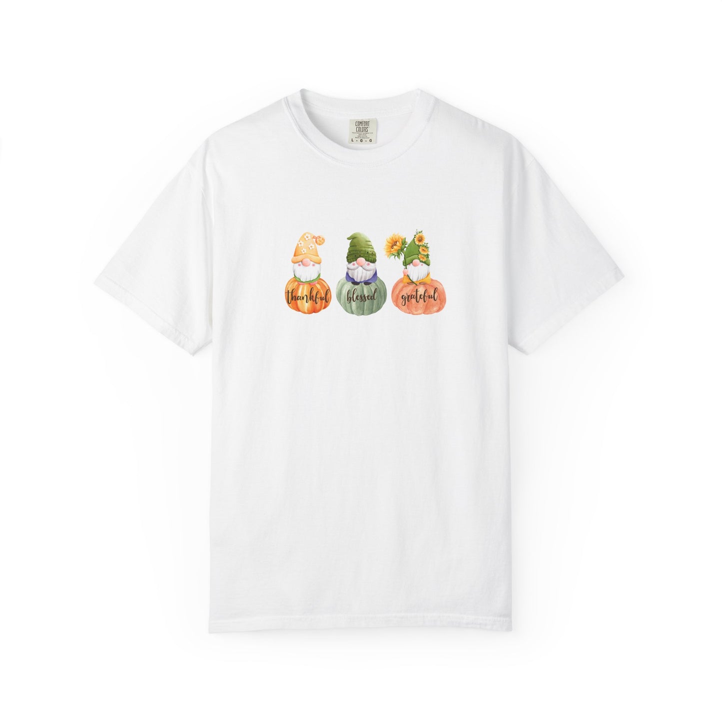 White t-shirt with gnomes and pumpkins design on a white background