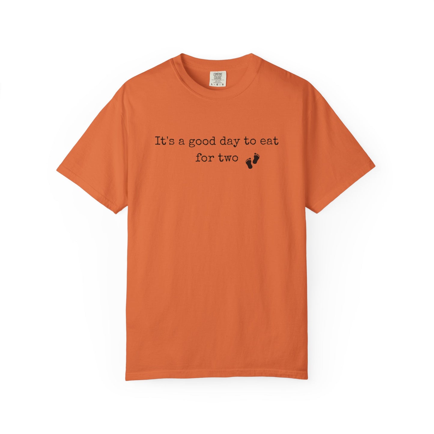 Orange t-shirt with text 'It's a good day to eat for two' on a white background
