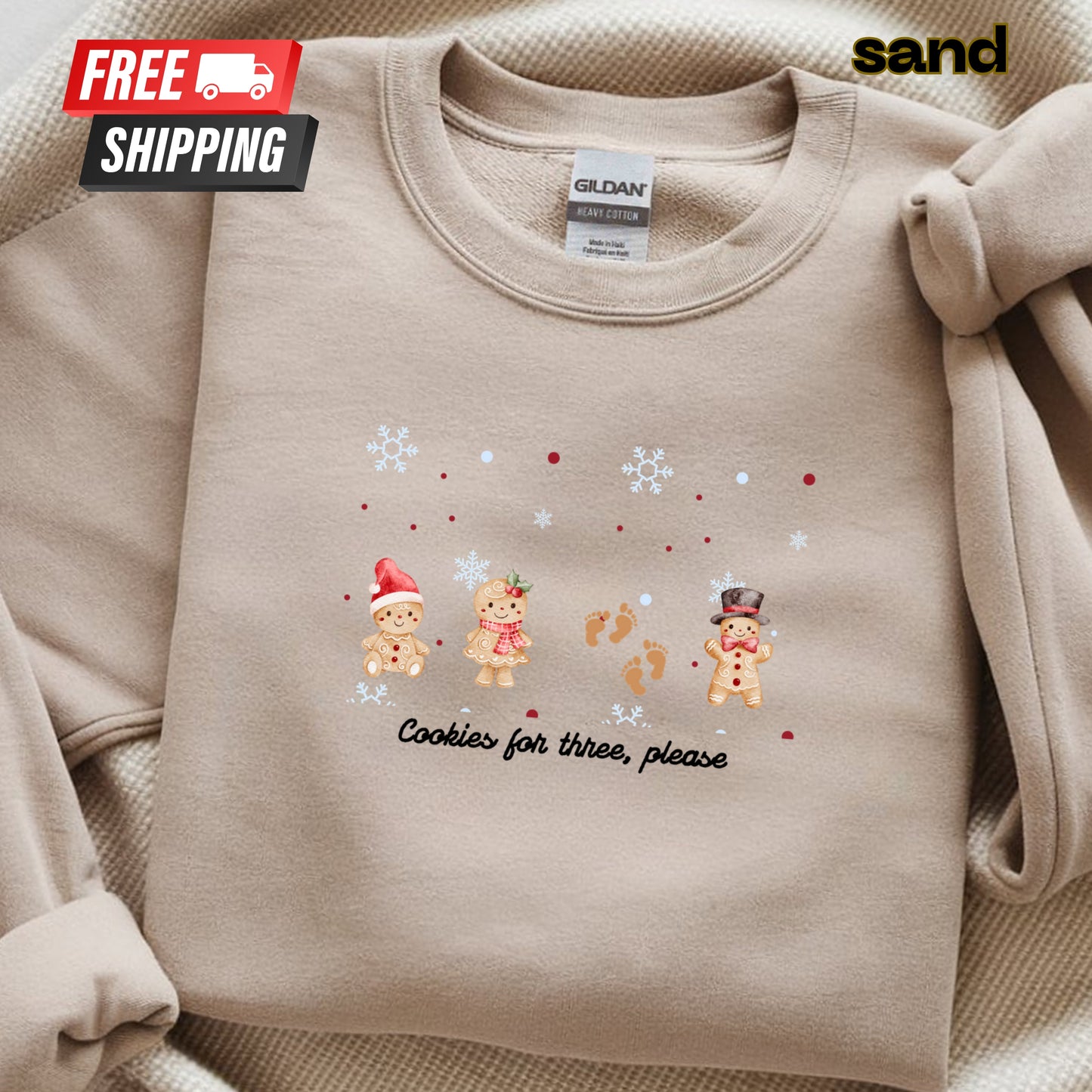 Beige sweatshirt with Christmas-themed design and 'sand' brand label.