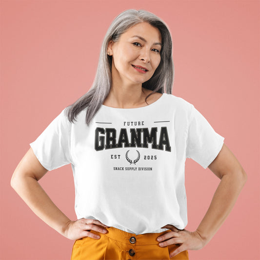 Woman wearing a white t-shirt with 'Future Grandma' text on a pink background