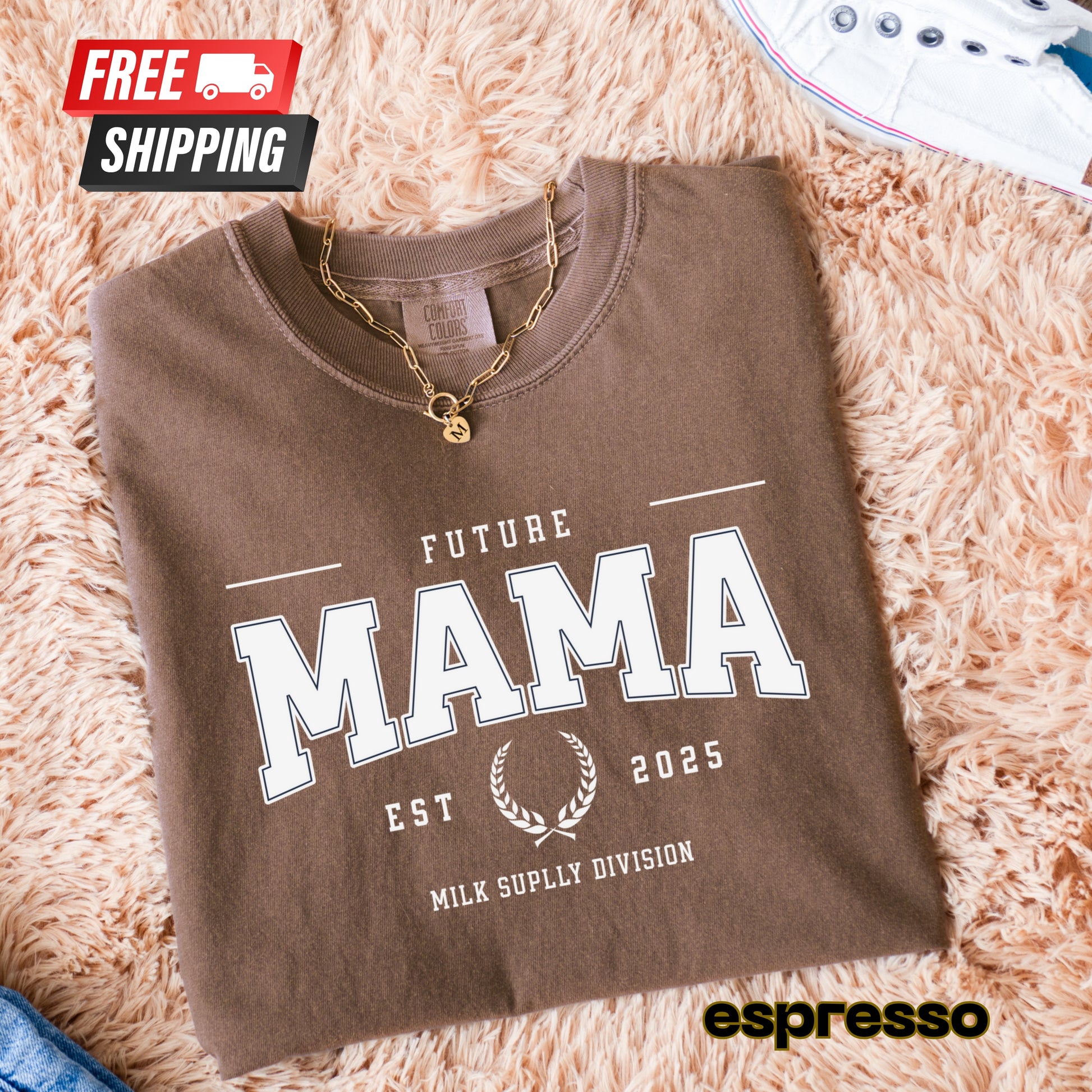Brown sweatshirt with 'Future Mama' text on a fluffy pink surface, featuring free shipping icon and espresso brand name.