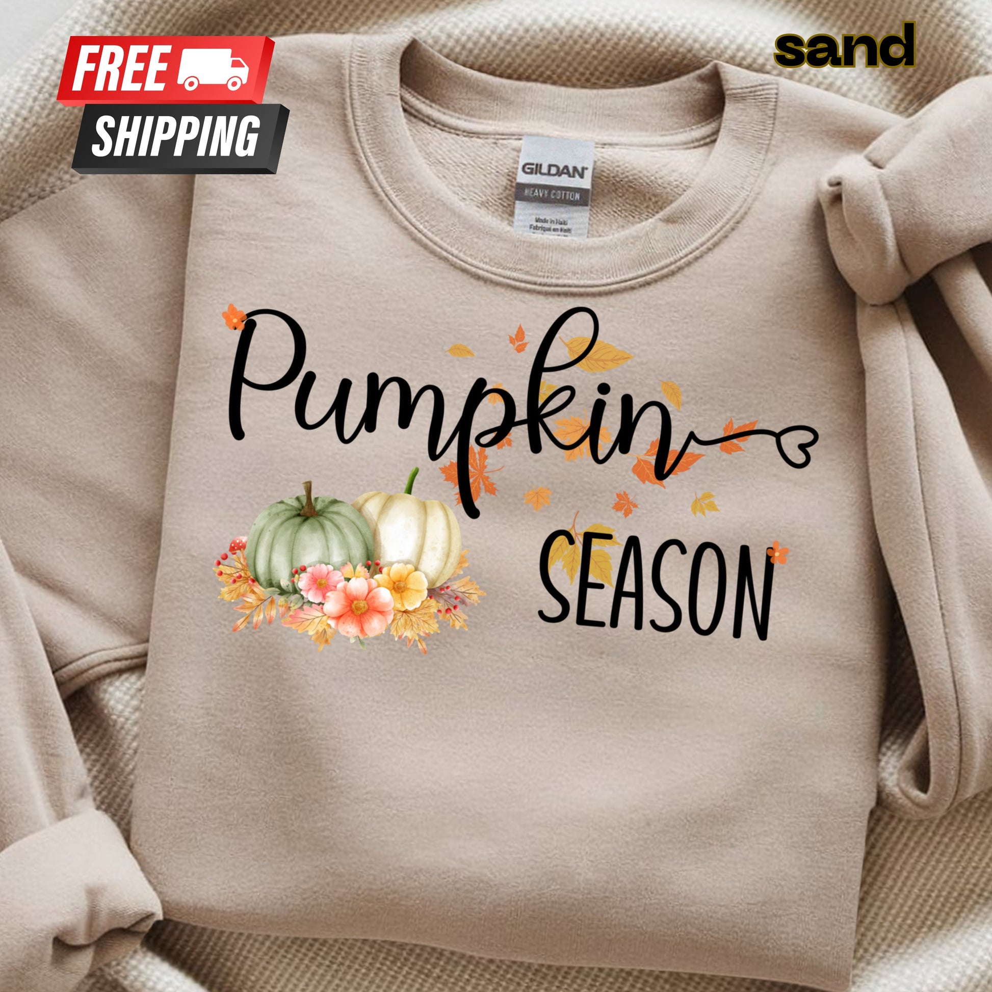 Beige sweatshirt with 'Pumpkin Season' text and pumpkins design, featuring a Gildan label.