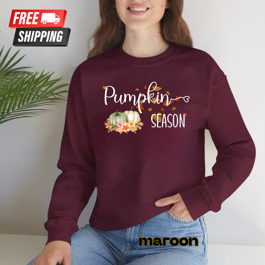 Person wearing a maroon sweatshirt with 'Pumpkin Season' text and graphics, sitting against a white background.
