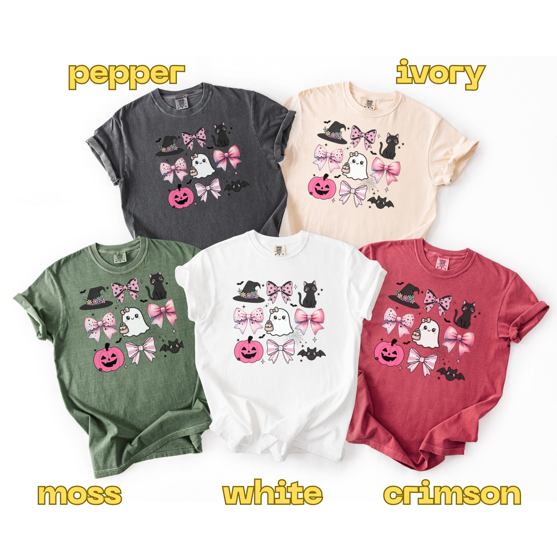 Five t-shirts in different colors with Halloween-themed designs on a white background.