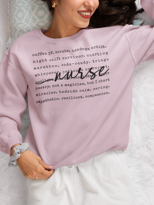 Person wearing a pink sweatshirt with text about being a nurse.